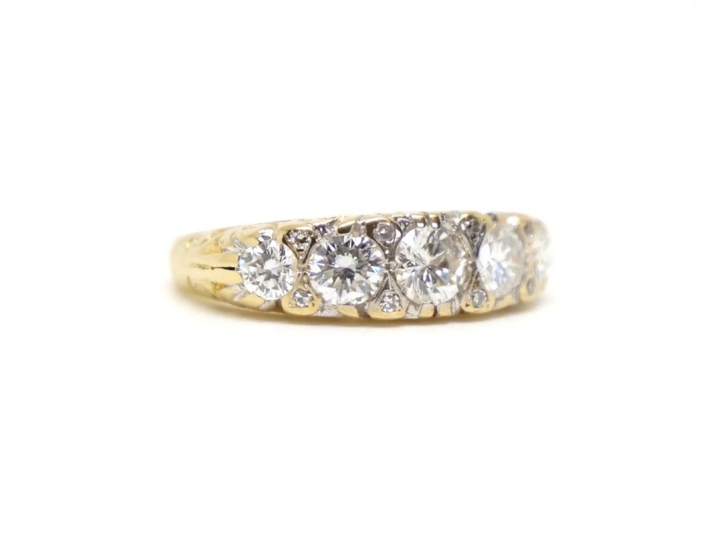 A vintage 18ct yellow gold ring featuring five brilliant-cut diamonds set in a horizontal row across the band. View III