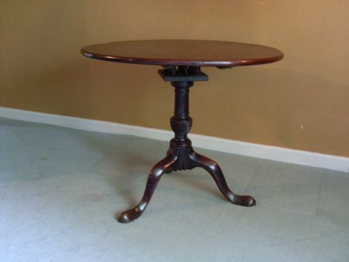A Geo III Tilt Top Tripod Table.