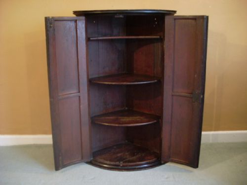 fig 1. An 18thC painted bow front corner cupboard