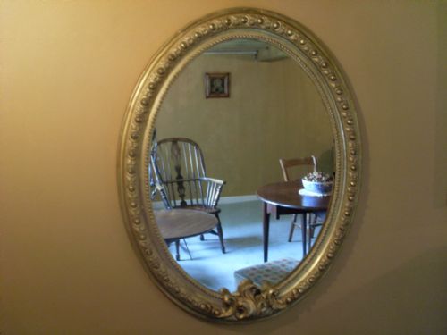 A Large Victorian Gilded Oval Mirror