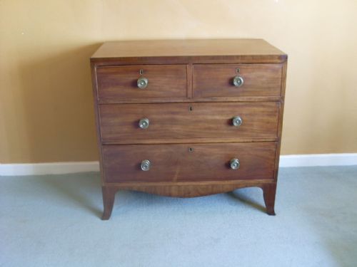 A Small Regency Chest with Kick Out Feet.