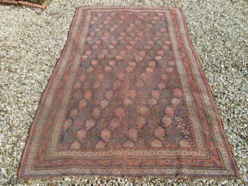fig 1. An antique rug 274cm X 145 cm