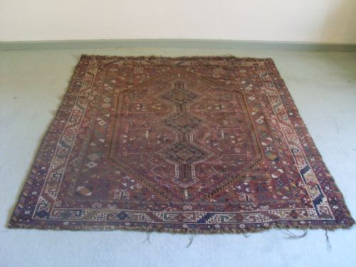 An Antique Rug 184 Cms by 156 Cms