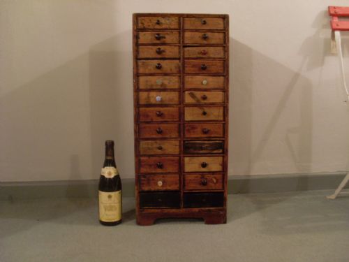 An Antique Pine Bank of 24 Drawers