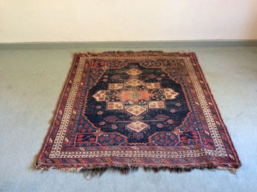 An Antique Area Rug