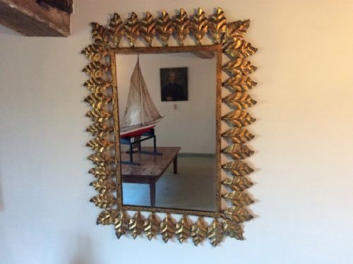 A Decorative Metal Leaf Framed Mirror