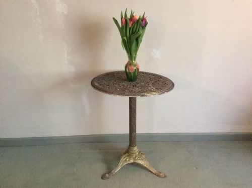 A Cast Metal and Iron Garden Table