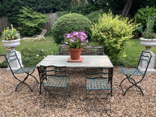 A SET OF FOUR FRENCH FOLDING IRON GARDEN CHAIRS - ADDITIONAL PHOTO 1