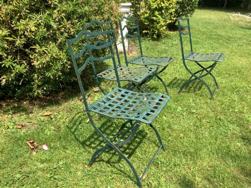 A SET OF FOUR FRENCH FOLDING IRON GARDEN CHAIRS - ADDITIONAL PHOTO 2