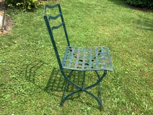 A SET OF FOUR FRENCH FOLDING IRON GARDEN CHAIRS - ADDITIONAL PHOTO 3
