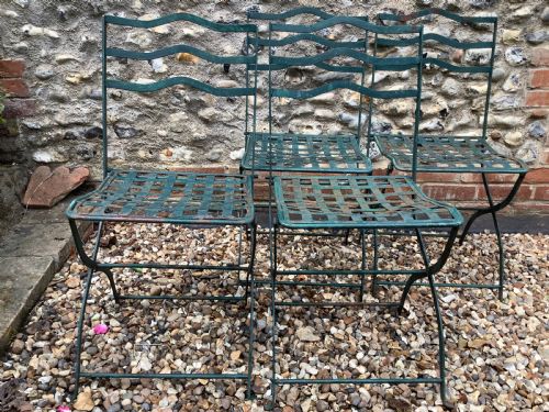 A SET OF FOUR FRENCH FOLDING IRON GARDEN CHAIRS - ADDITIONAL PHOTO 4