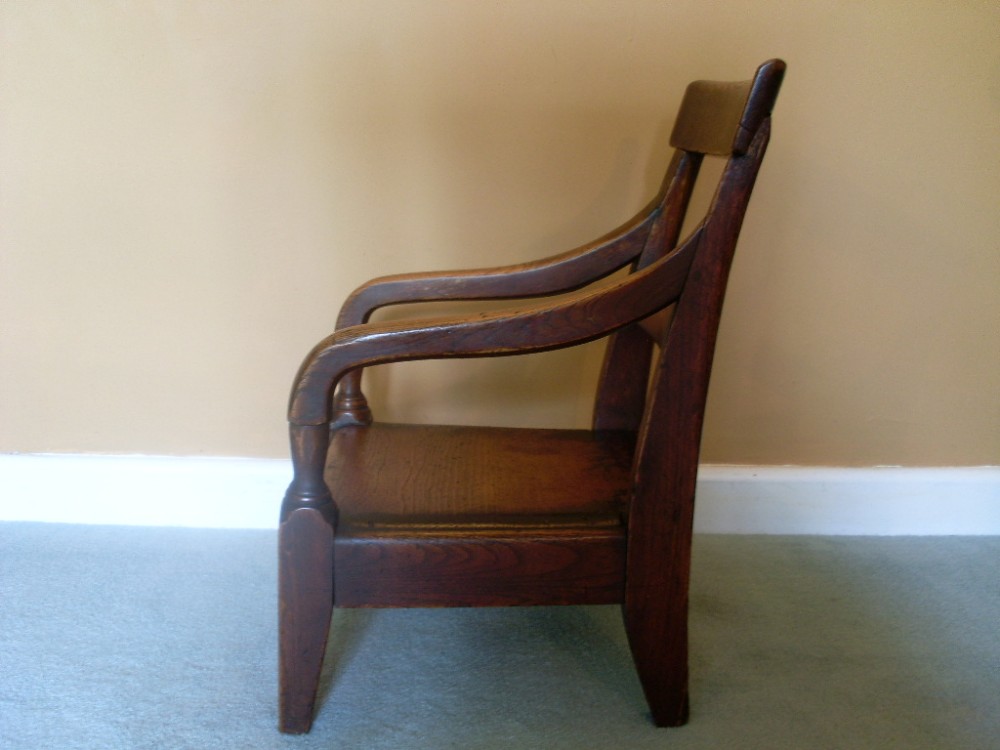 An early 19thC elm framed childs chair