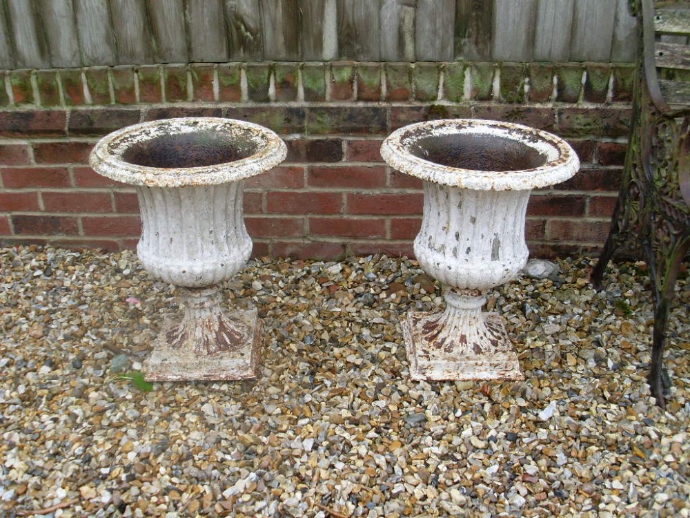 A pair of Victorian cast iron Urns
