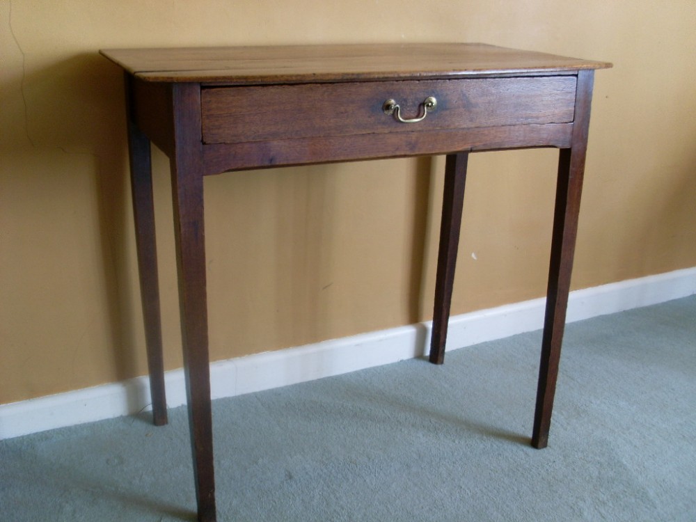 A Georgian oak bow topped side table