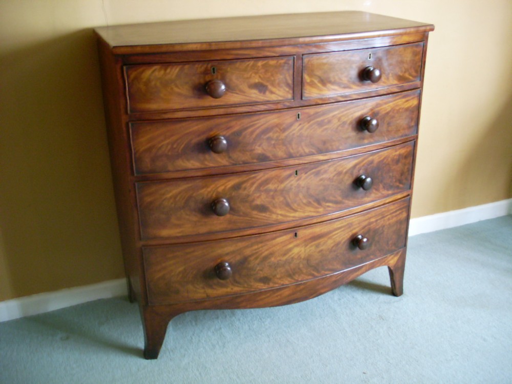 A 19thC flame mahogany bow front chest