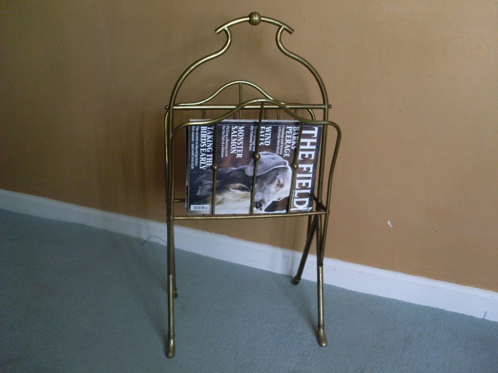 An early 20thC brass magazine rack or stand