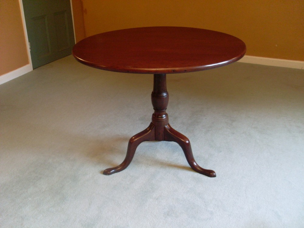 A large Geo III cuban mahogany tilt top tripod table