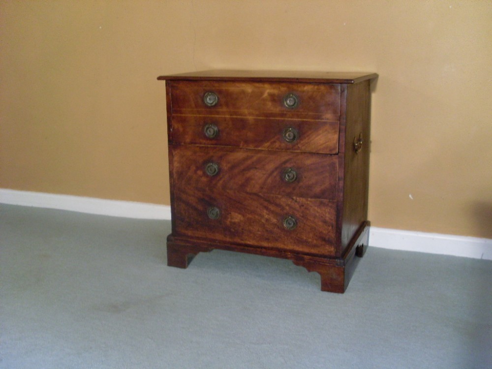 A small 19thC faux chest or bedside table