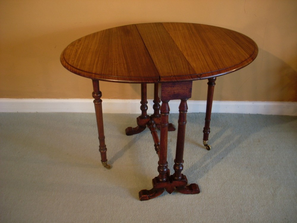 An early Victorian rosewood sutherland table
