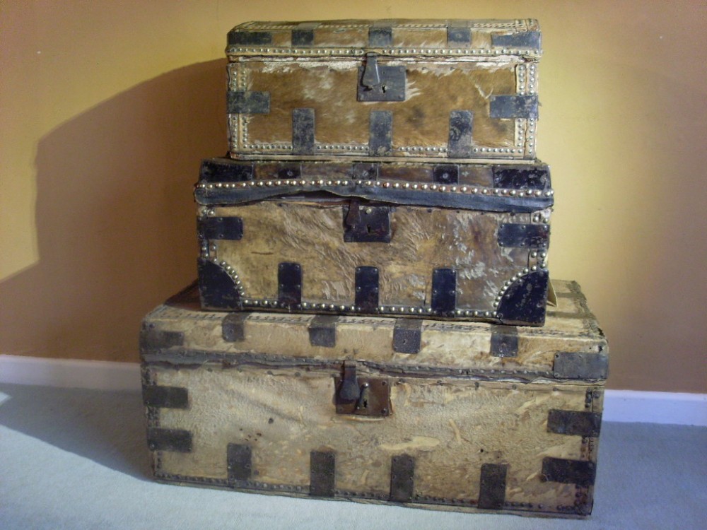 A stack of 3 18thC trunks