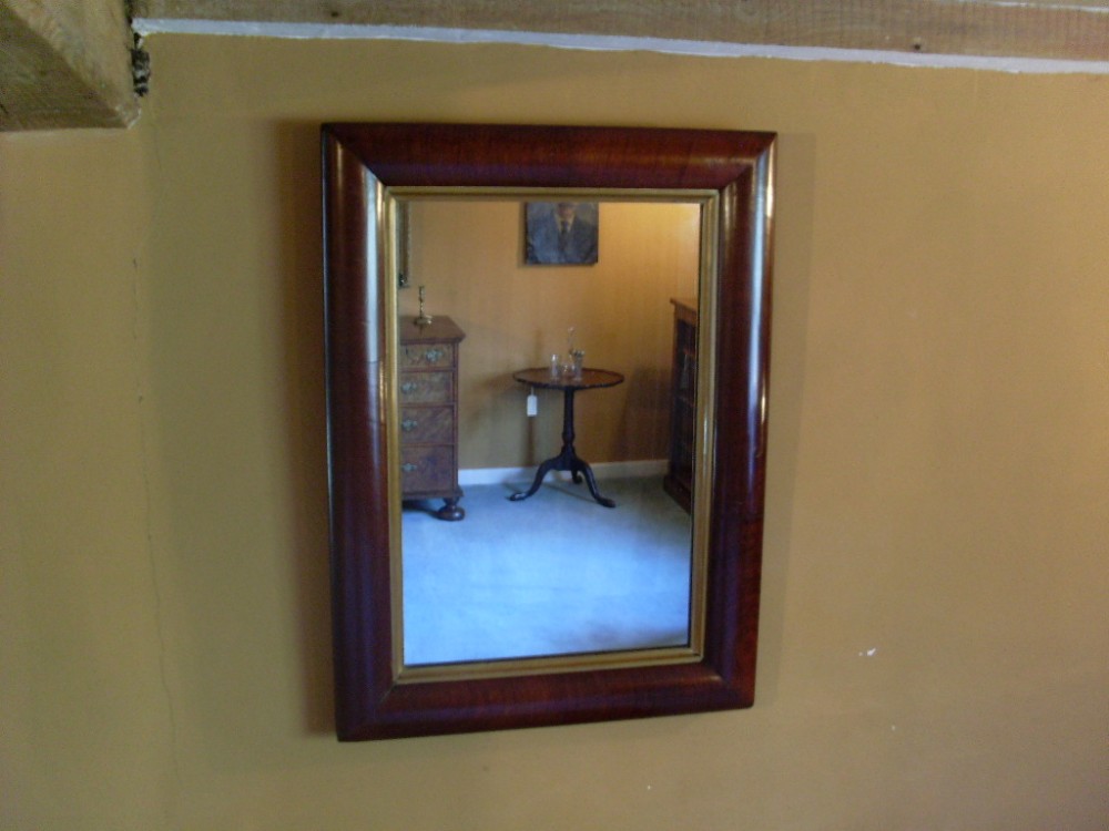 A Victorian cushion mirror