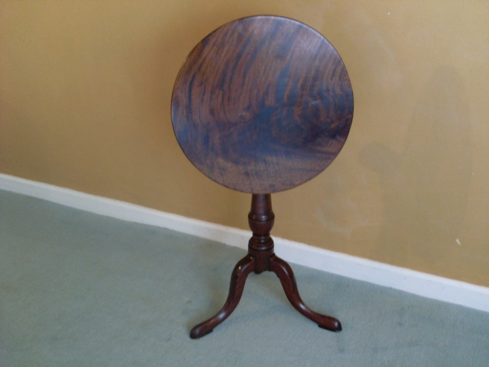 A small Geo III mahogany tilt top tripod table
