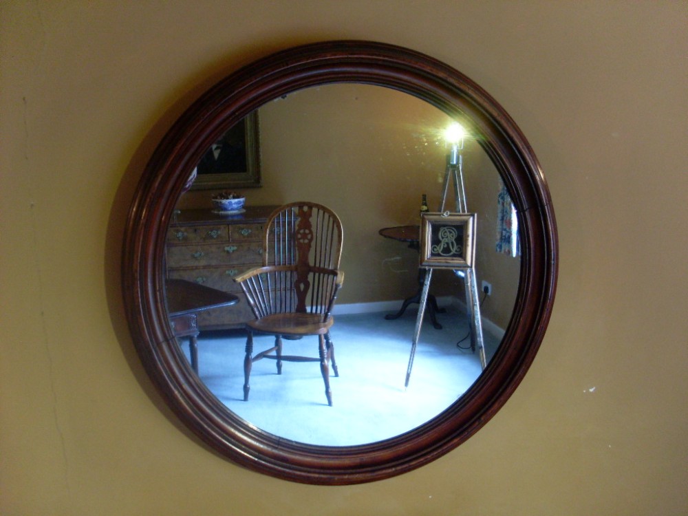 A large Victorian circular hall mirror