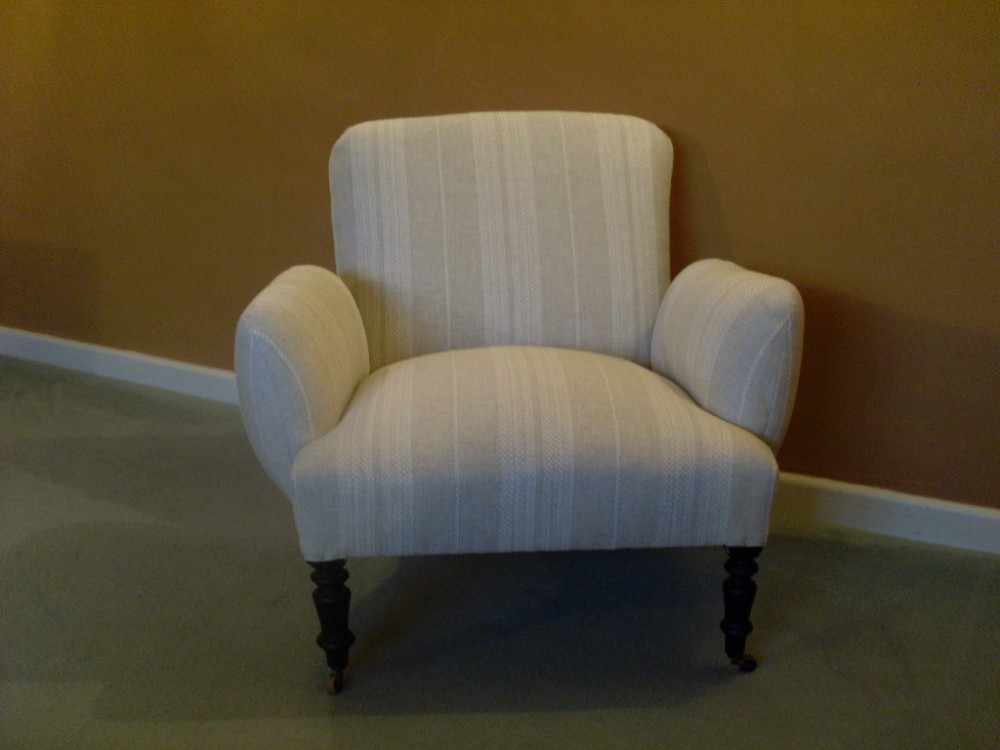 A French Napoleon III low backed armchair
