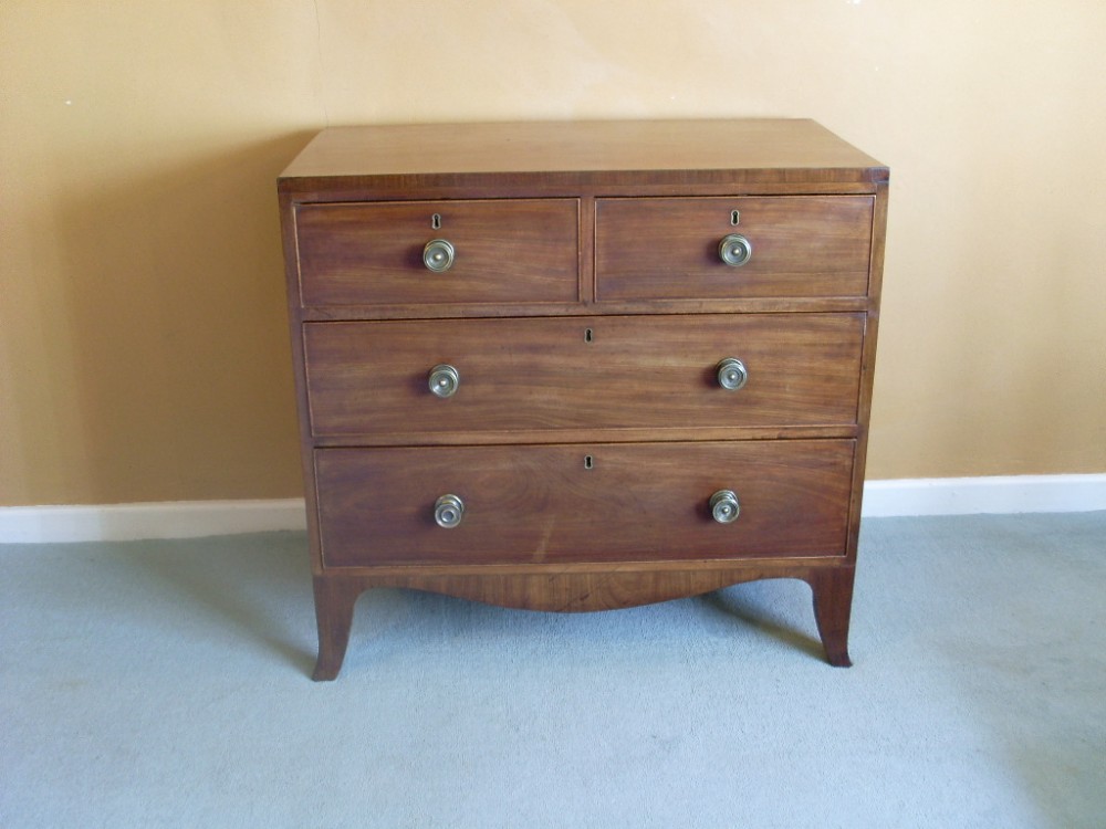 A small Regency chest with kick out feet.