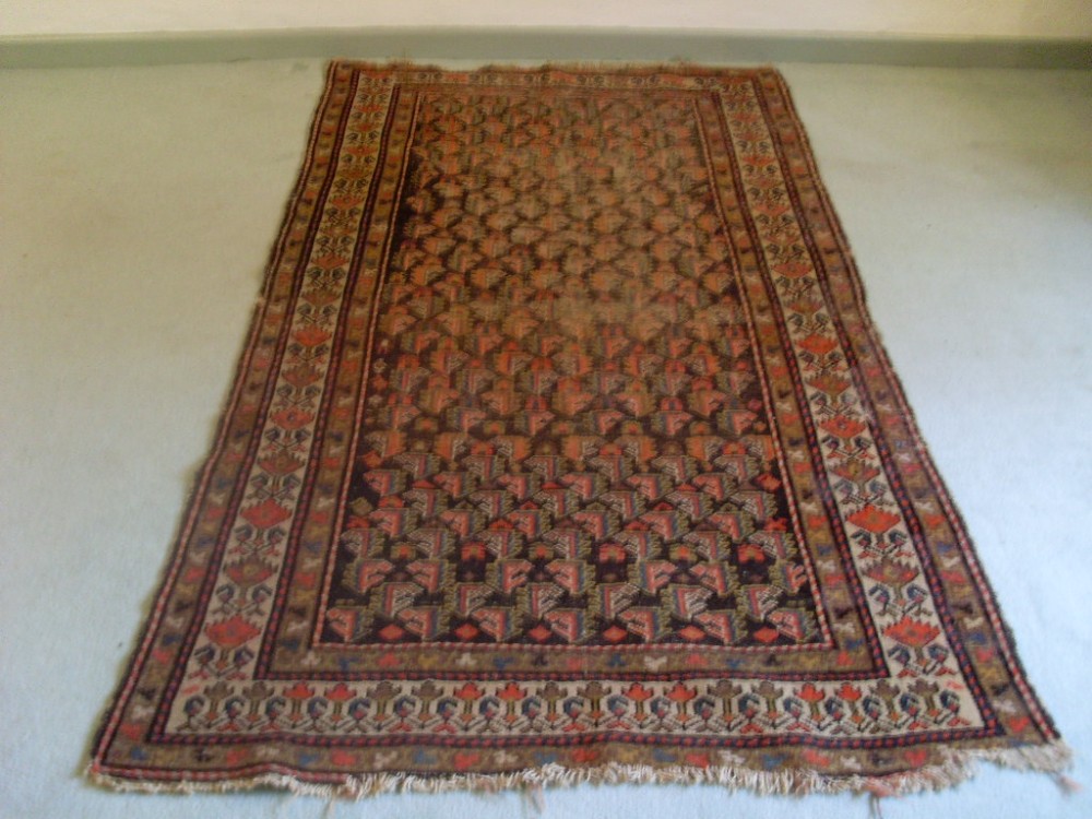 An antique Caucasian rug