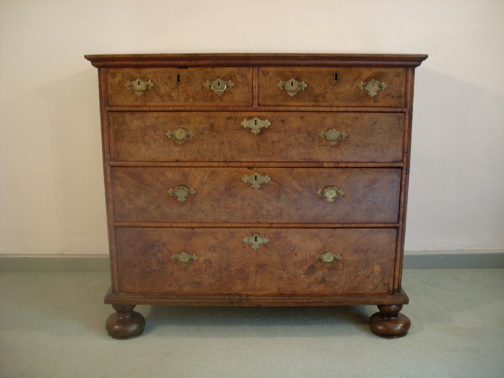 A Queen Anne early 18thC walnut chest