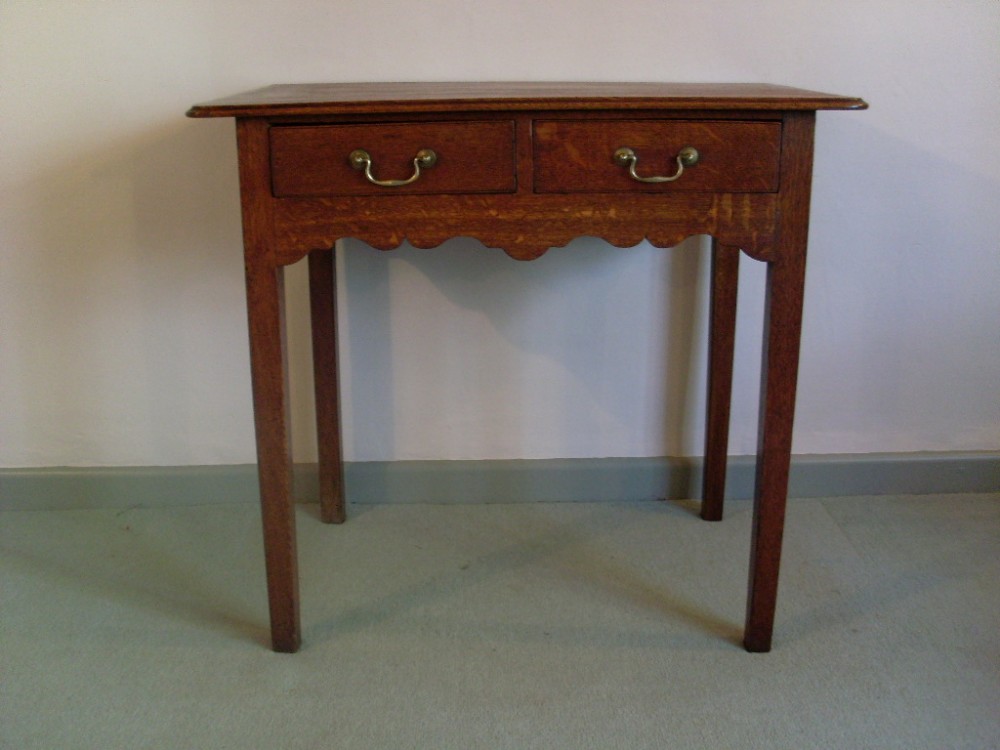 A Georgian oak lowboy style table