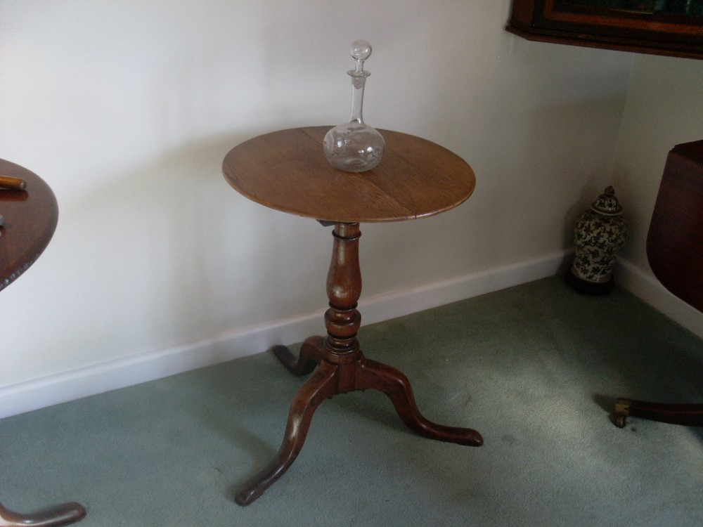 A 19thC oak tilt top tripod table