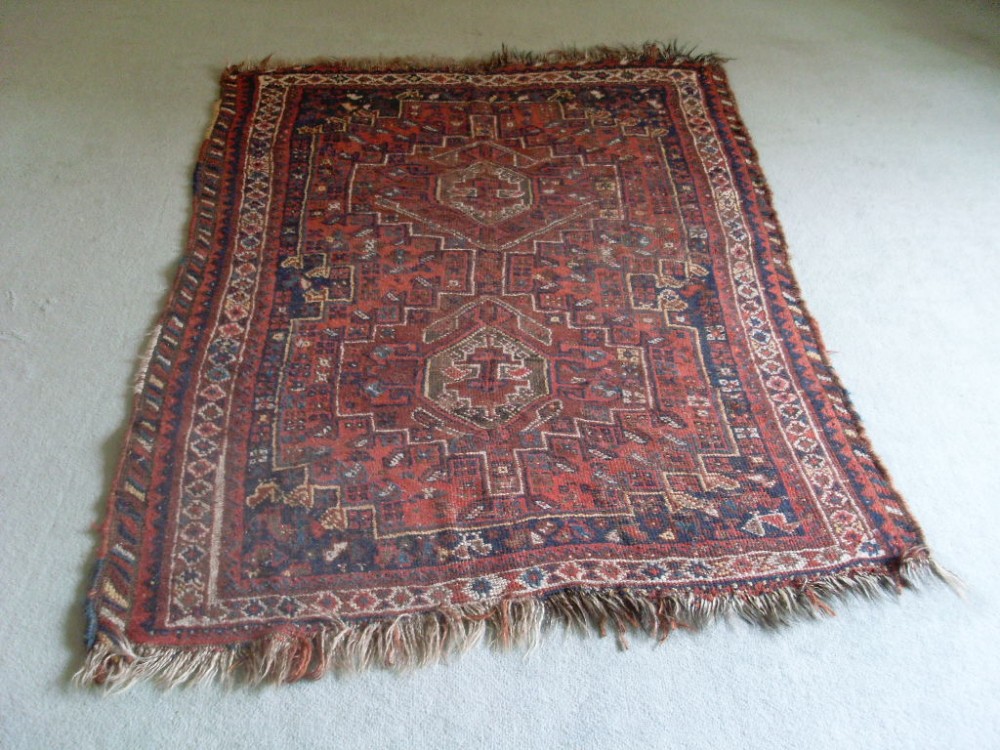 An antique rug 160 x 110 cms