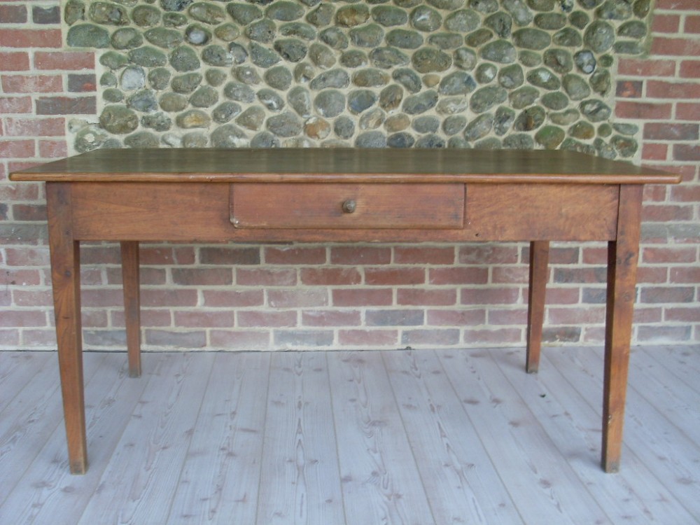 A 19thC French elm and pine kitchen table