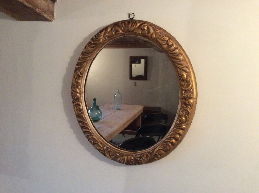 A 19thC gilded oval wall mirror