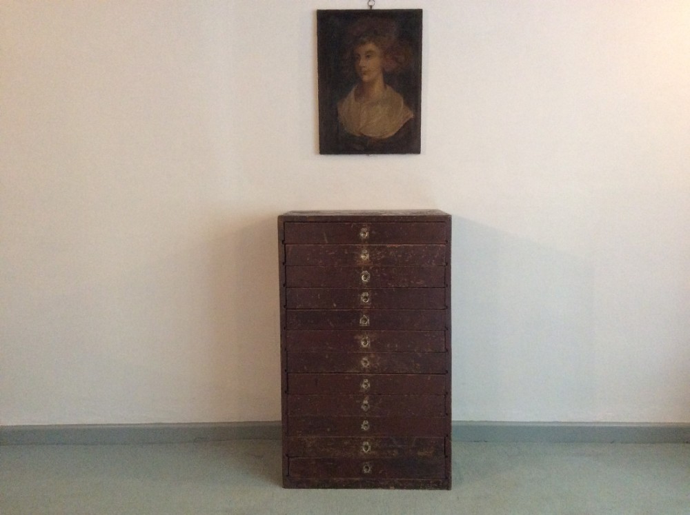 A painted bank of collectors drawers