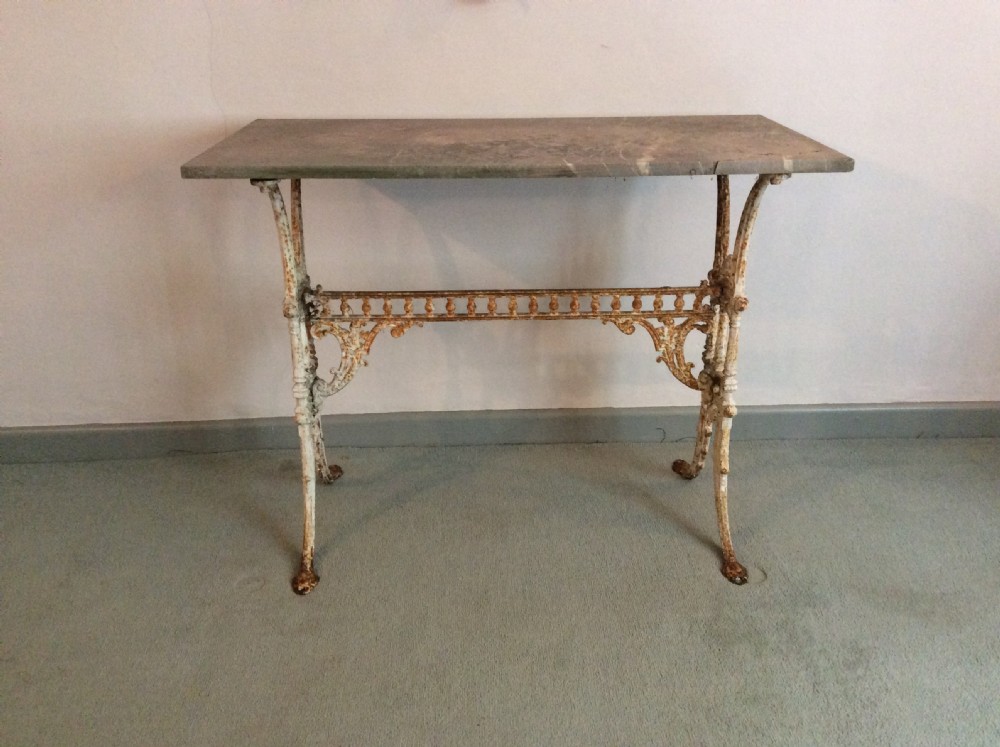 A French cast iron based marble topped conservatory table