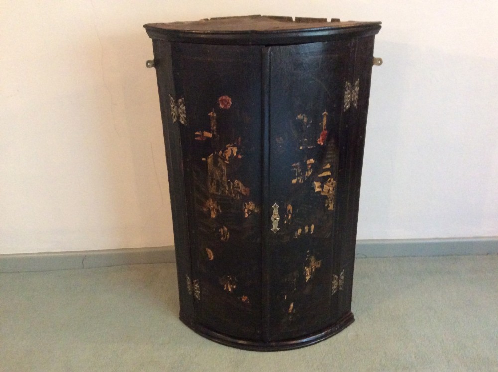 A Georgian chinoiserie corner cupboard