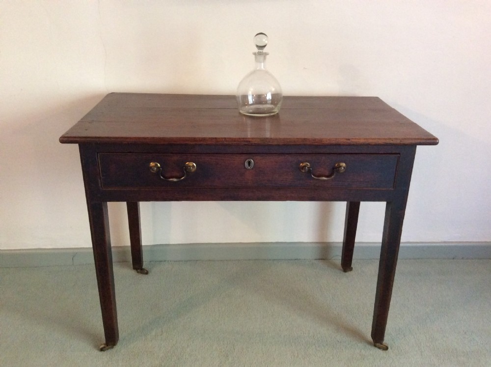 A Georgian oak side table