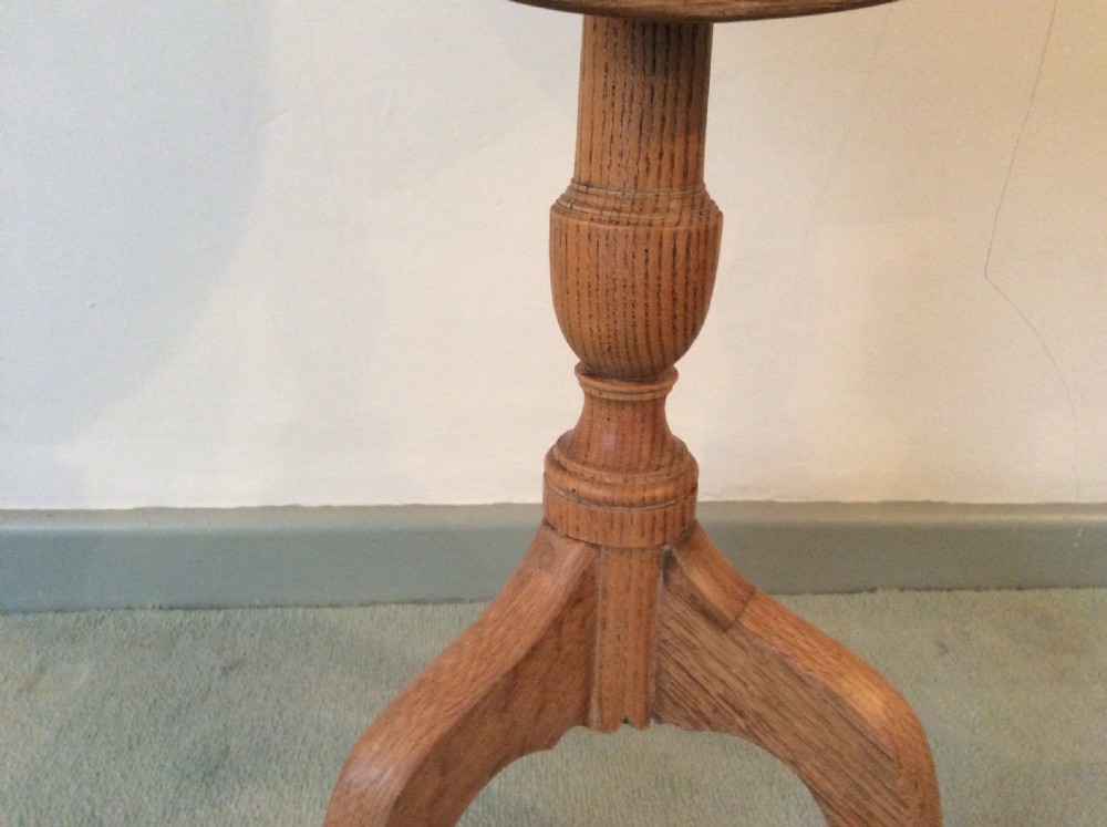 A 54 cm dia bleached oak and elm tripod  table View IV