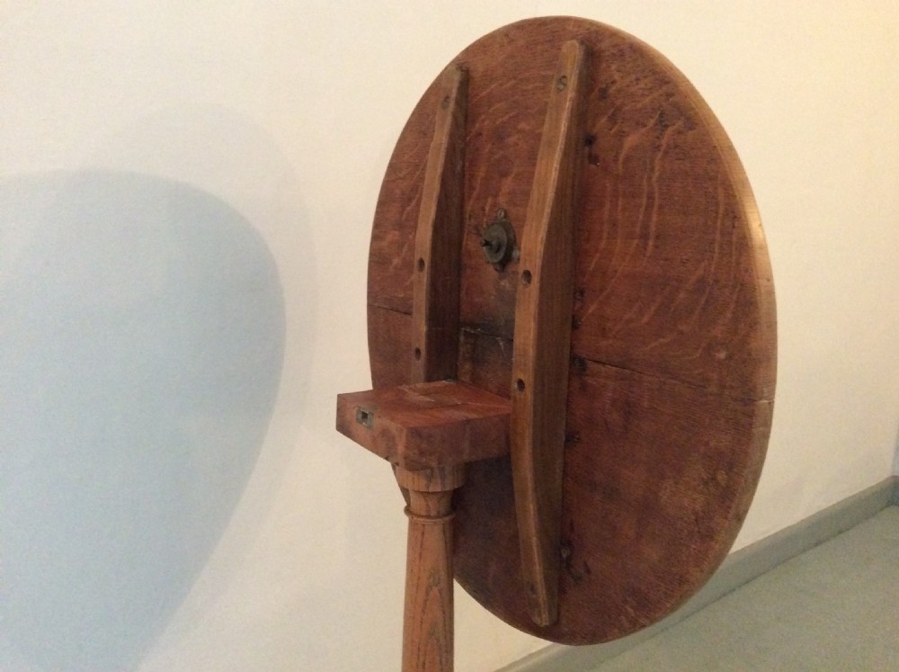 A 54 cm dia bleached oak and elm tripod  table View VI