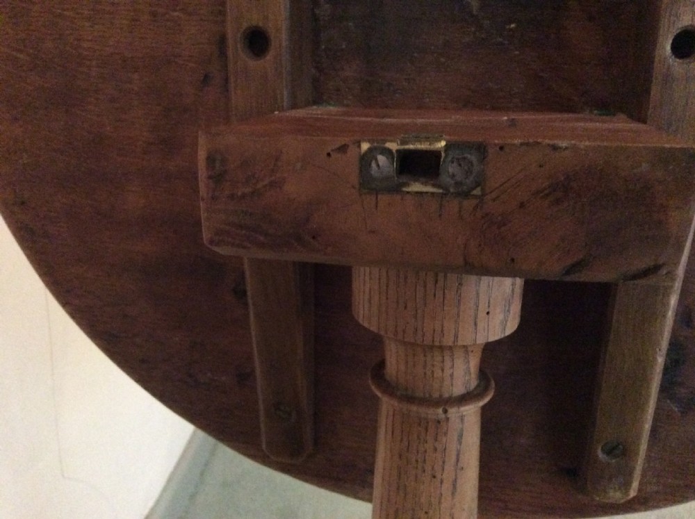 A 54 cm dia bleached oak and elm tripod  table View VIII