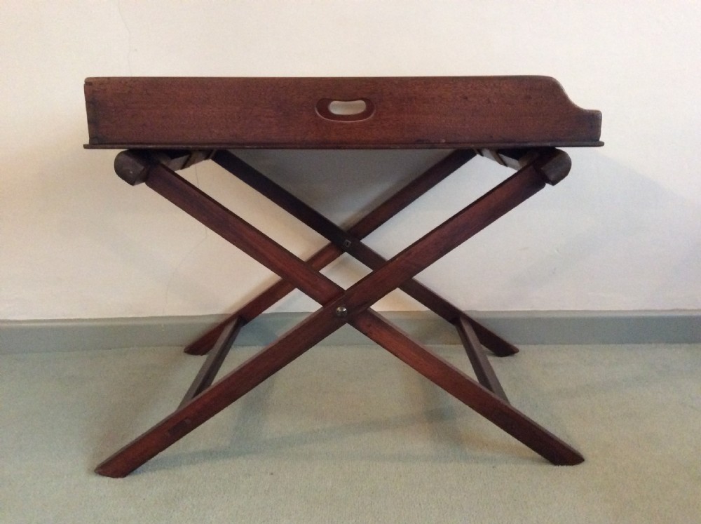 A butlers tray on a low stand