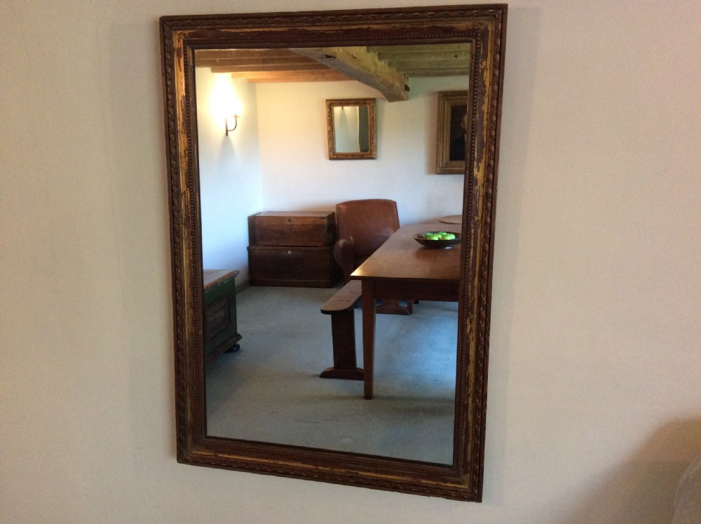 A French carved wood framed mirror