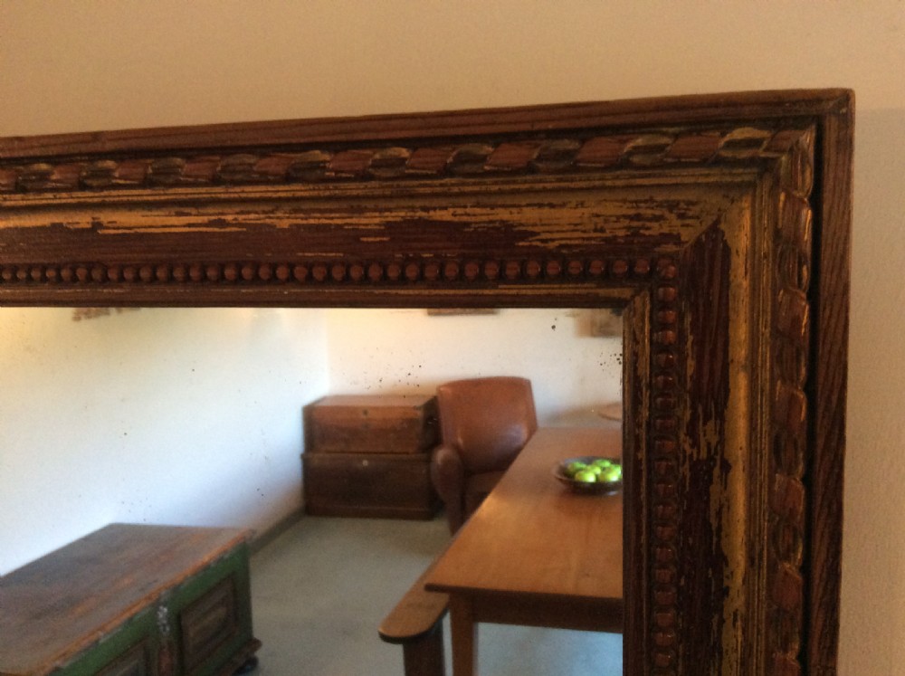 A French carved wood framed mirror View II