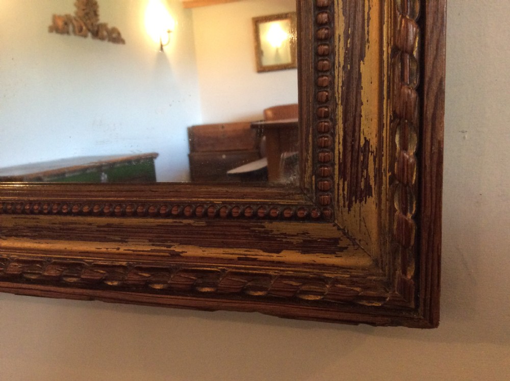 A French carved wood framed mirror View III