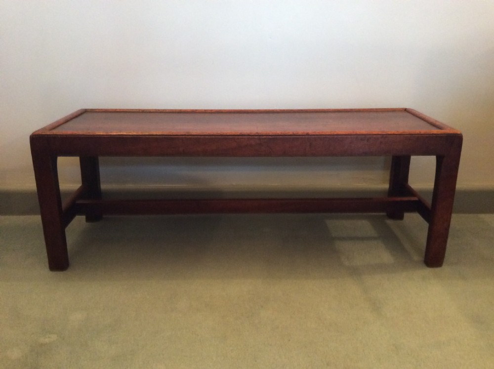 A Georgian long solid top stool