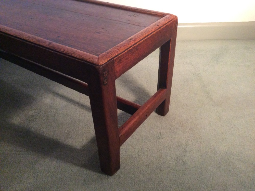 A Georgian long solid top stool View XI