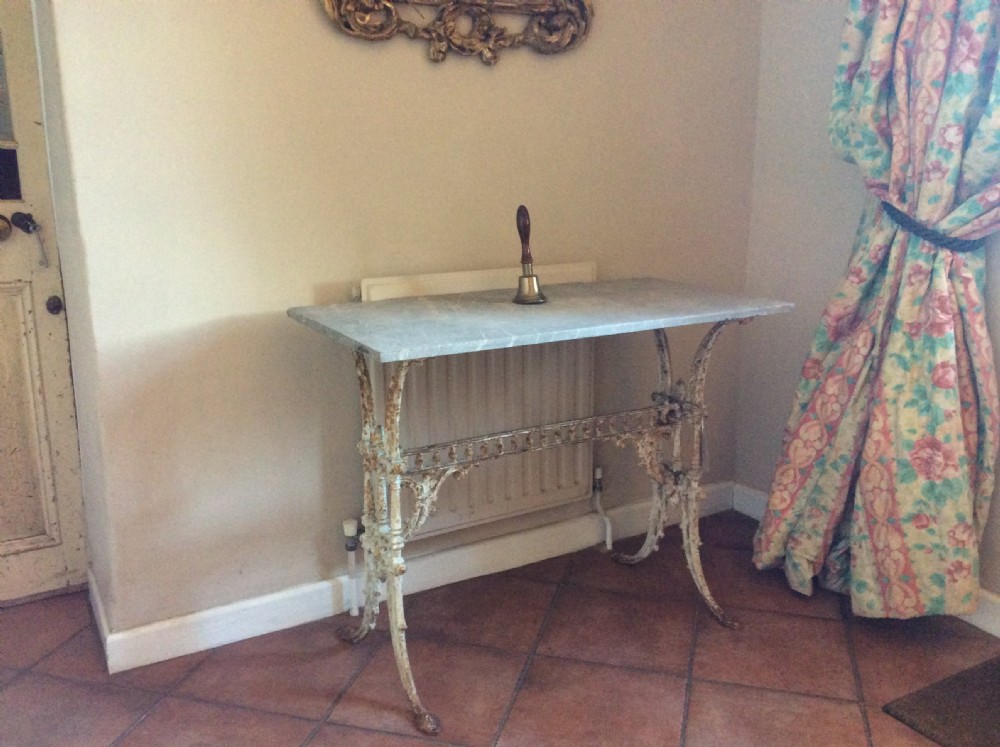 A French cast iron based marble topped conservatory table View III